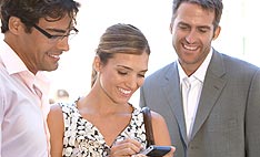 Picture of people viewing a PDA