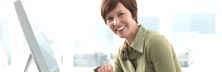 Picture of a person at a computer screen - Customer Portal