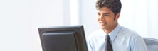 Picture of a person at a computer screen - Support Portal